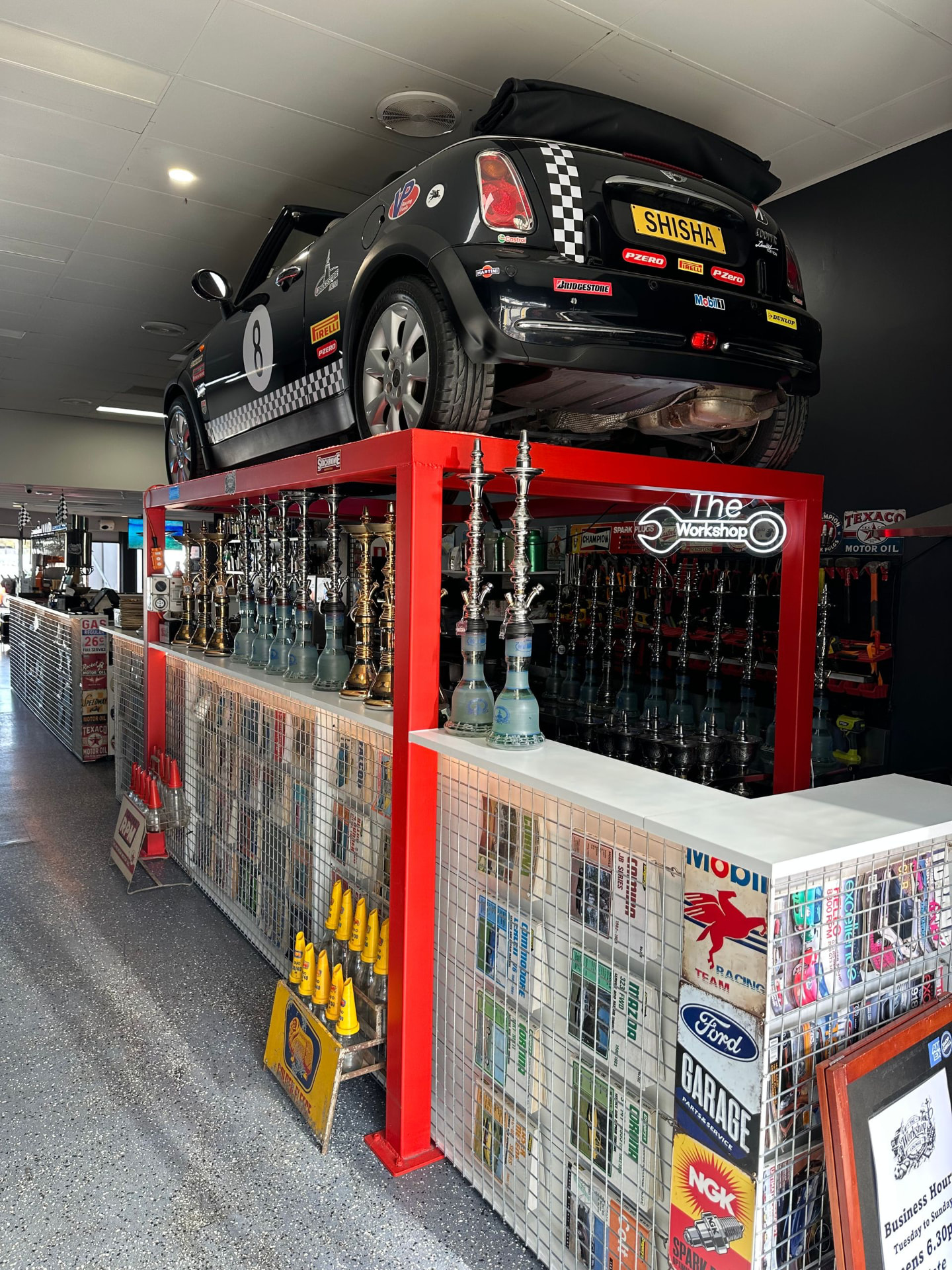 Black Mini Cooper with SHISHA plates mounted above the shisha station